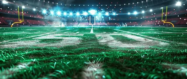 Green football field under night stadium lights spotlighting the 50-yard line marking